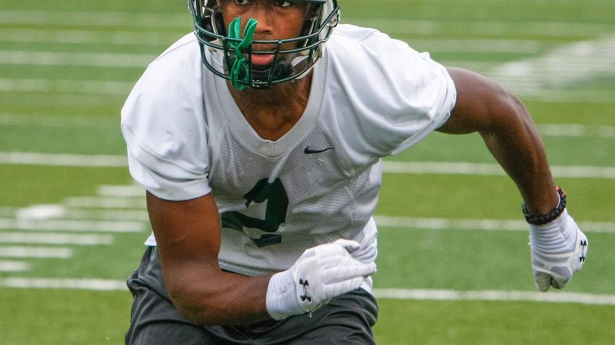 The Dutch Fork Silver Foxes football team began practice Friday, looking to make it to the State Championship game again this year. Stephen Davis goes through a defensive drill during practice.