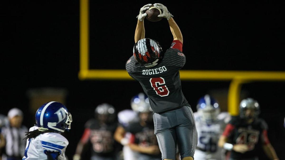Gilbert's Jackson Digieso (6) intercepts a pass during the game against Dreher last season. The Indians and Blue Devils meet Friday night at Memorial Stadium.
