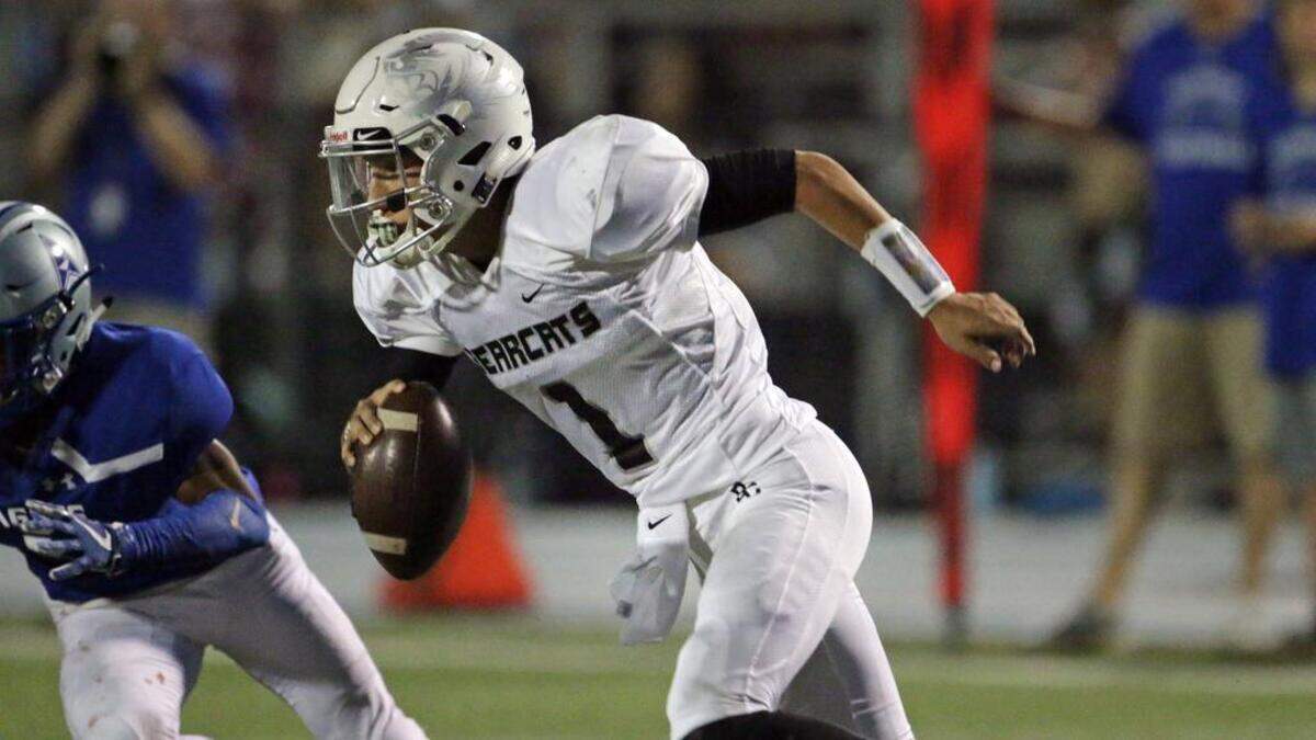 Brookland-Cayce quarterback Reed Charpia rolls out and looks for running room Friday night against Airport.