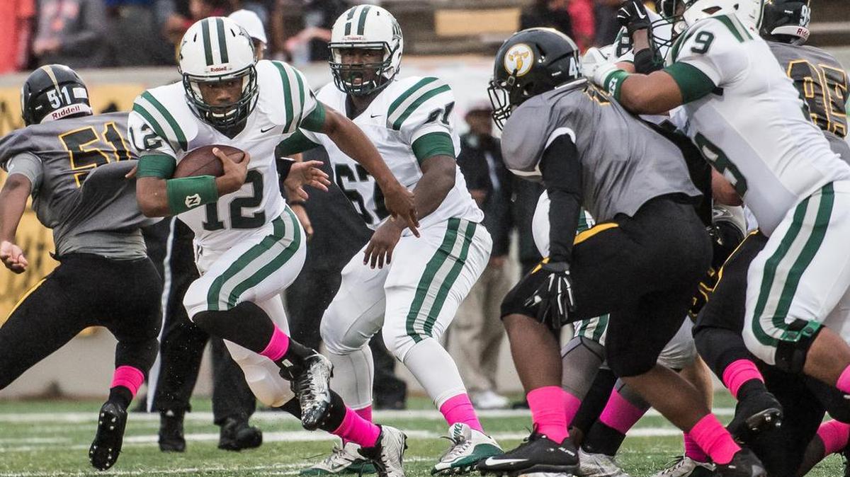 
Dutch Fork quarterback Cole Douglas picks up yardage the first half Friday night against Irmo.
