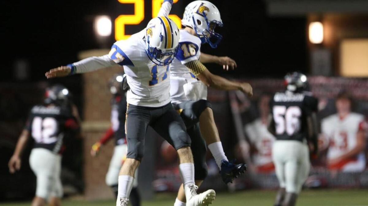 
Lexington’s Donny Baker (17) and Brandon Blake celebrate a touchdown against Westwood.
