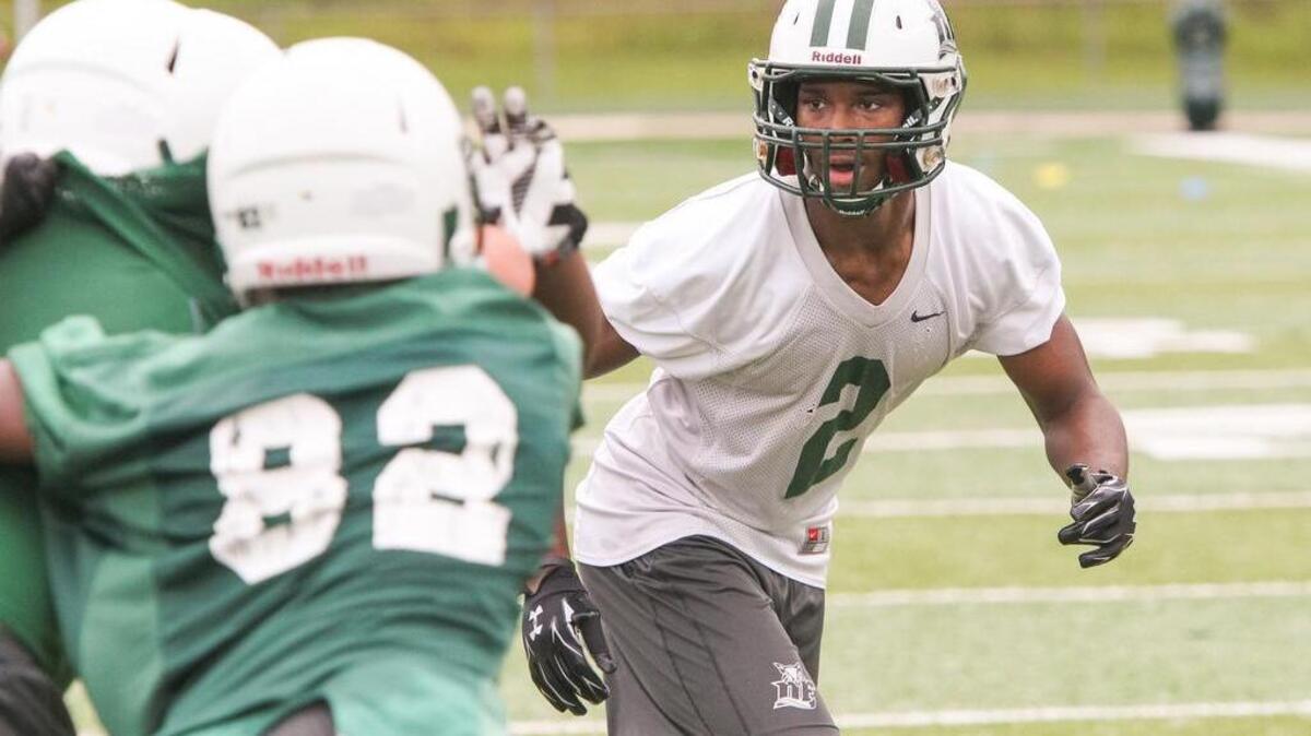 
Dutch Fork defensive back Stephen Davis follows the play during the first day of practice in 2014. 
