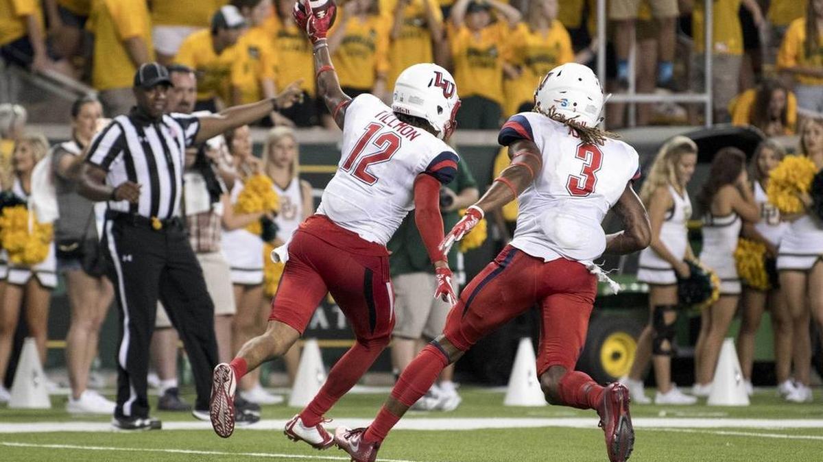 Former River Bluff standout Brandon Tillmon (12) comes up with an interception for Liberty on the final play of the game in the 48-45 victory over Baylor on Saturday.