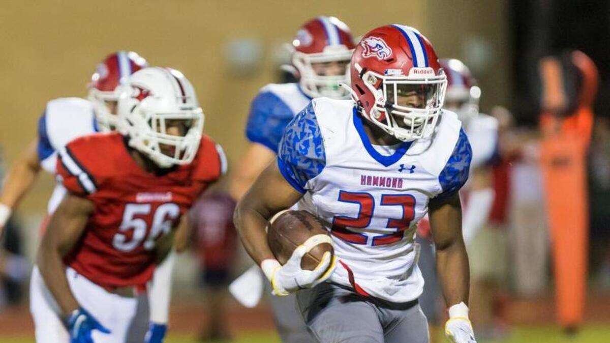 Hammond Skyhawks running back C.J. Stokes III (23) rushes for a touchdown against the Cardinal Newman Cardinals.
