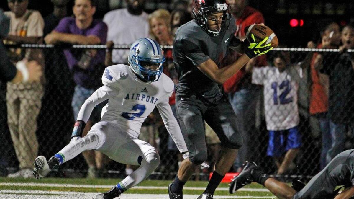 
Brookland-Cayce's Dominick Byars intercepts a ball intended for Airport's Keryon Richardson in a 2014 game. 
