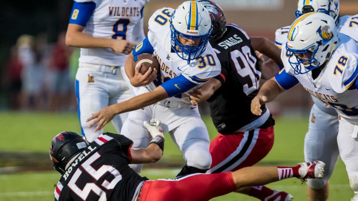 Lexington Wildcats Taylor Mathias (30) rushes during the game between Lexington HS at Gilbert HS.
