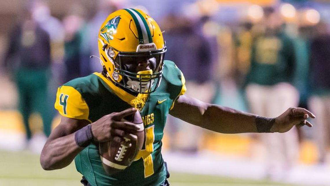 Spring Valley Vikings quarterback DeQuandre Smith (4) scrambles for a touchdown against the Nation Ford Falcons.