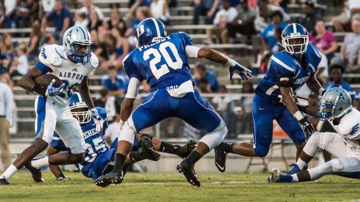 
Airport’s Tamon Nottingham looks for a hole in the Dreher defense Friday night at Memorial Stadium. 
