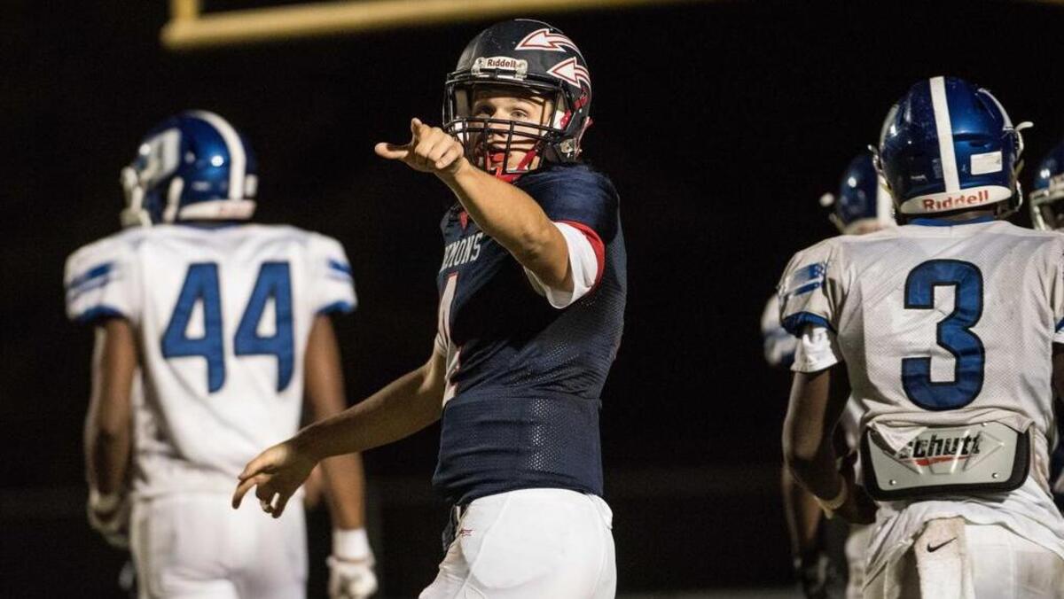 Lugoff-Elgin quarterback Chandler Price celebrates a touchdown against Dreher. Price and the Demons face Berkeley in the second round of the Class 4A playoffs.