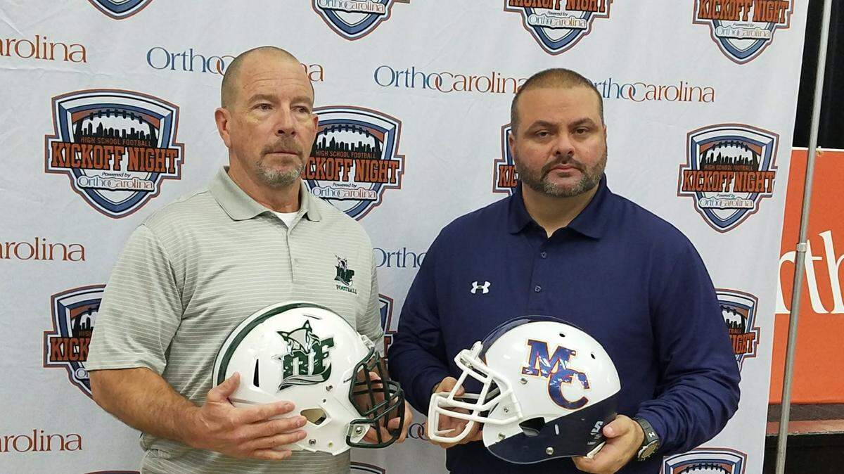 Dutch Fork coach Tom Knotts, left, and Mallard Creek coach Mike Palmieri will lead their teams into a highly-anticipated matchup in August. The game could be played at Bank of America Stadium in Charlotte.
