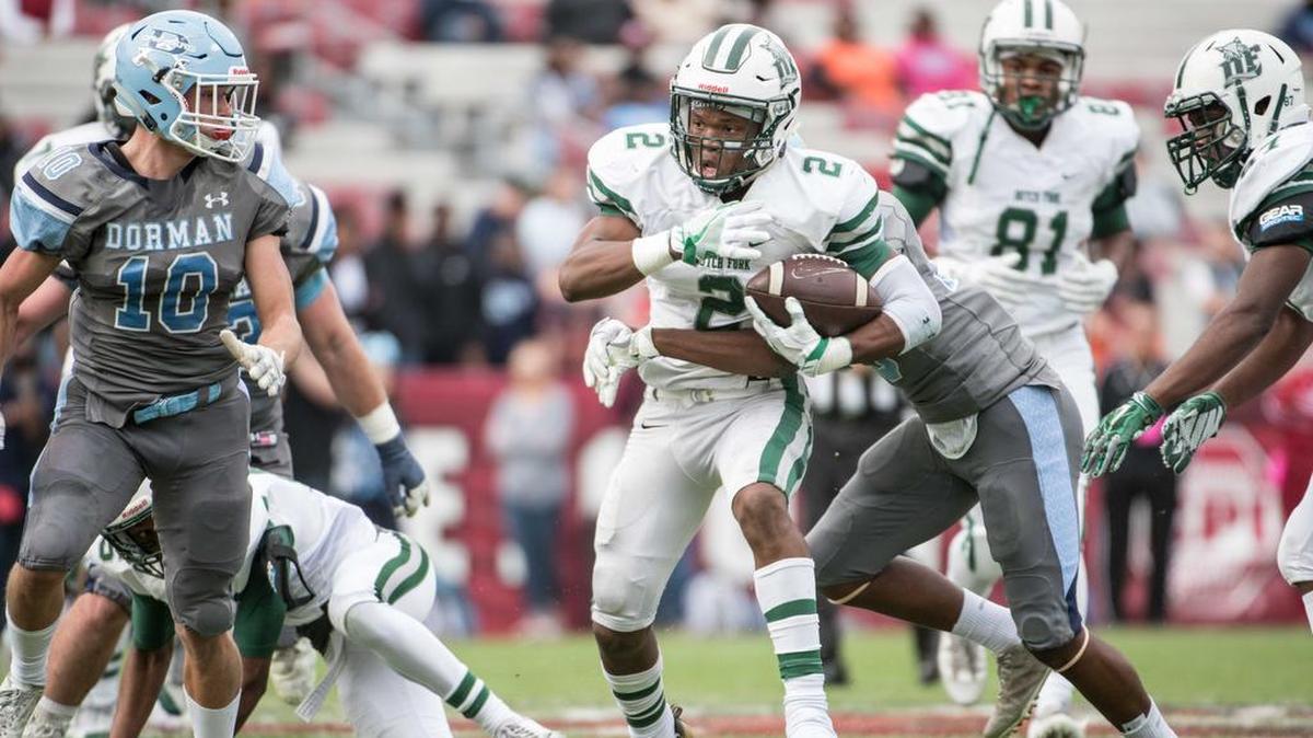 Dutch Fork's Bryce Thompson carries the ball against the Dorman defense during the Class 5A state championship Dec. 1, 2017, at Williams Brice Stadium in Columbia, S.C.