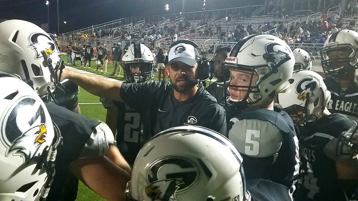 Gray Collegiate coach Adam Holmes talks to his team during a timeout of the game against Columbia High School on Thursday, Oct. 4, 2018.