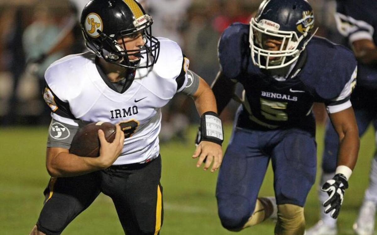 
Blythewood linebacker Cassius Garner pursues Irmo quarterback Mason Smith during their game Friday night at Blythewood. 
