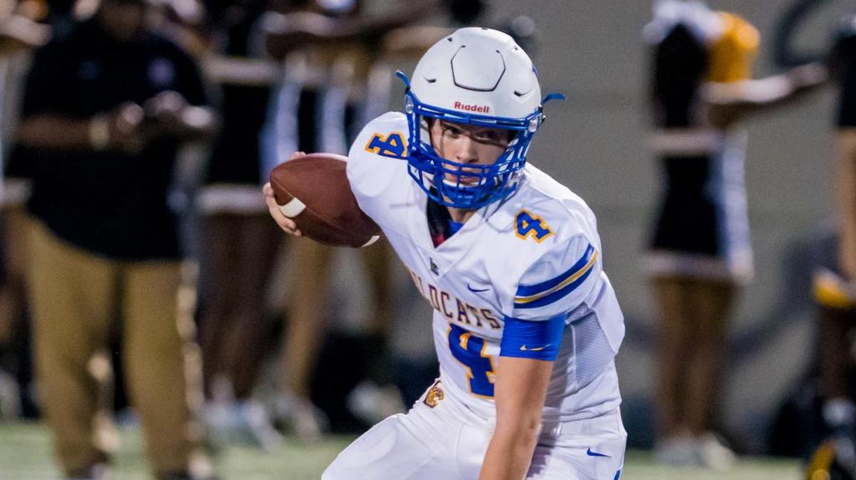 Lexington Wildcats QB Cal Herndon (4) looks for running room during the game between Lexington High School and Irmo High School at Irmo High School