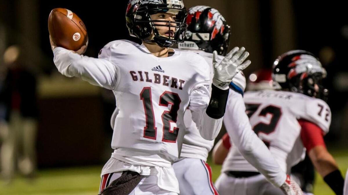 Gilbert quarterback Josh Strickland (12) passes during a game last season. The Indians moved into the Midlands Top 10 poll this week.