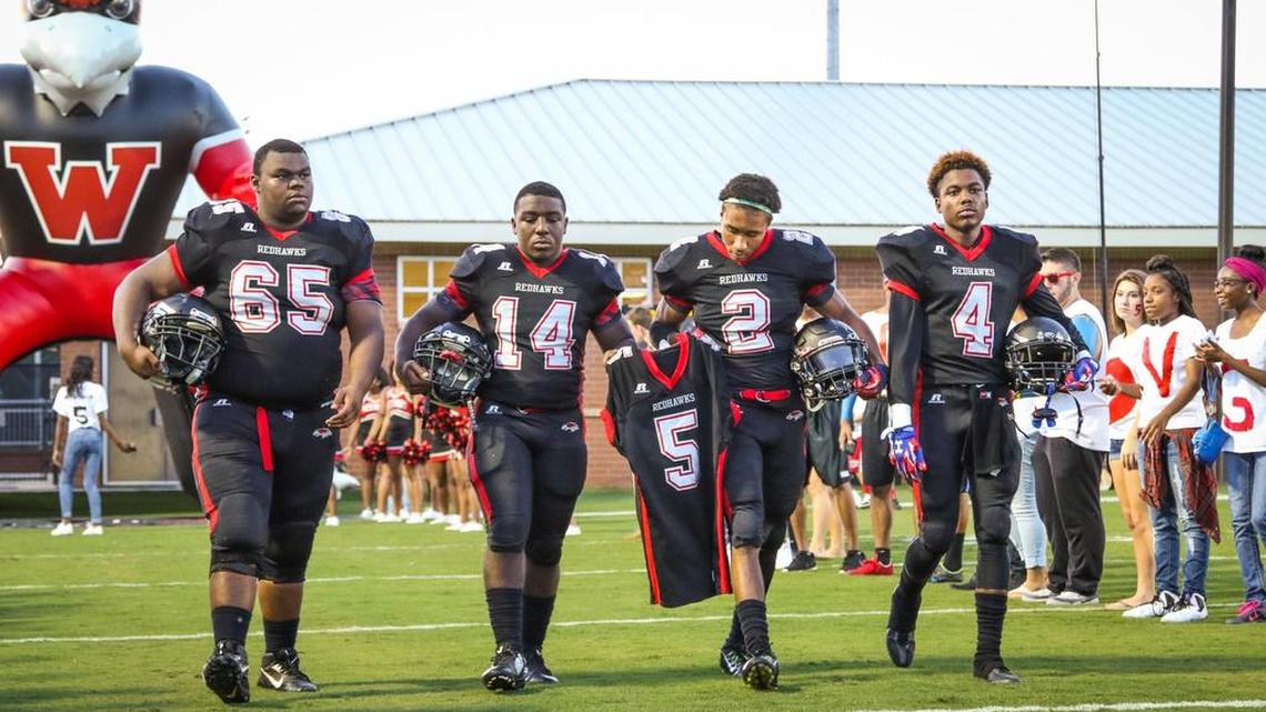 
The Keenan at Westwood game took on a whole new meaning Friday night with tributes from both teams to Westwood player Mark Mickens, who is recovering from a neck injury. The team captains carried Micken's shirt to the coin toss at midfield before the game.
