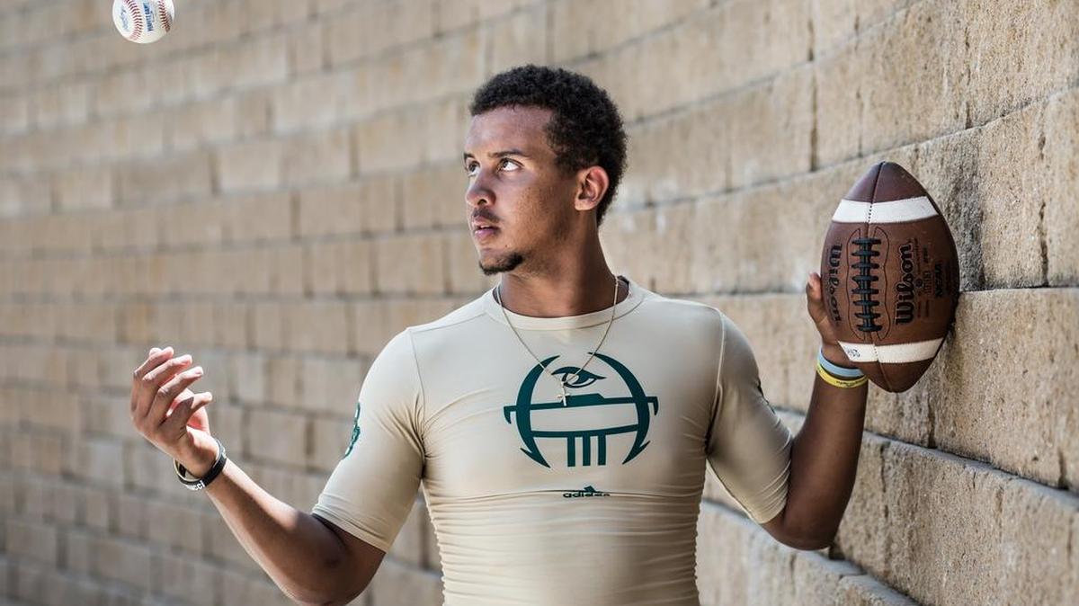 
Brandon Tillmon at River Bluff High School in Lexington, South Carolina. Tillmon is a right-handed pitcher on the baseball team and the starting quarterback who throws the football with his left arm.
