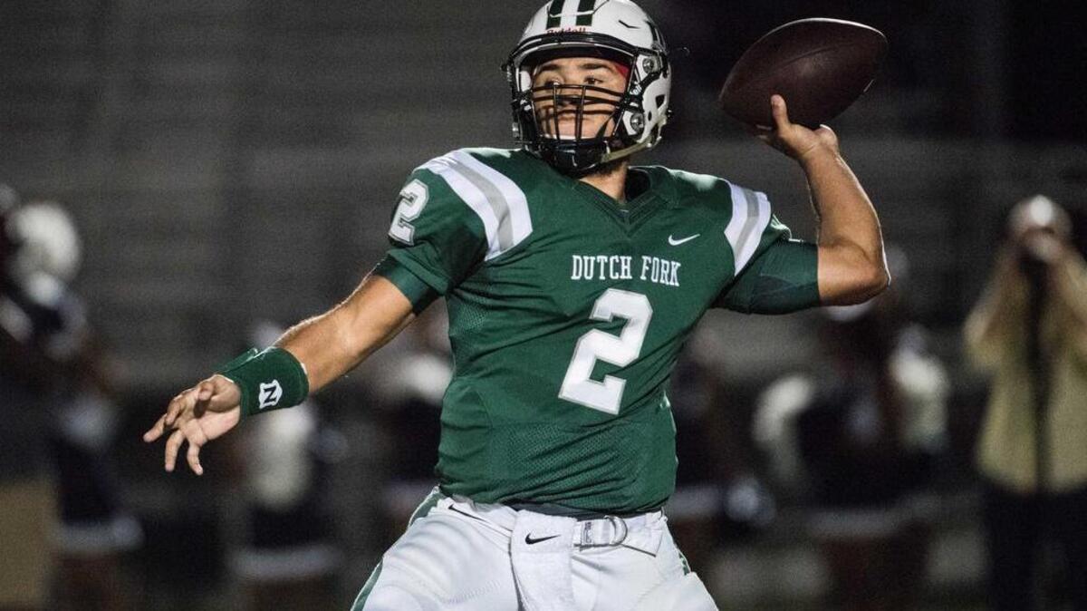 Dutch Fork quarterback Reese Nichols attempts a pass against the Blythewood defense Friday night at Dutch Fork High School.