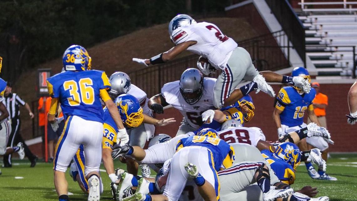 
White Knoll's Gary Shell (2) nears the goal line during the first half of their game against Fort Mill at the Battle on the Bluff on Thursday.
