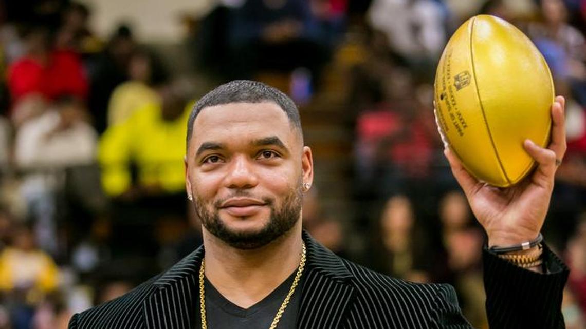 Former Lower Richland football Richard Seymour, who won three Super Bowls with the New England Patriots, is presented with a golden football as part of an NFL program honoring the high schools of Super Bowl participants.