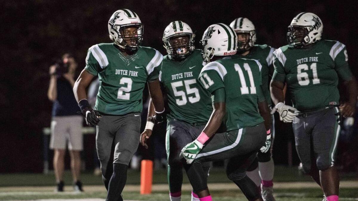 Dutch Fork's Bryce Thomson (2) and other Dutch Fork players
