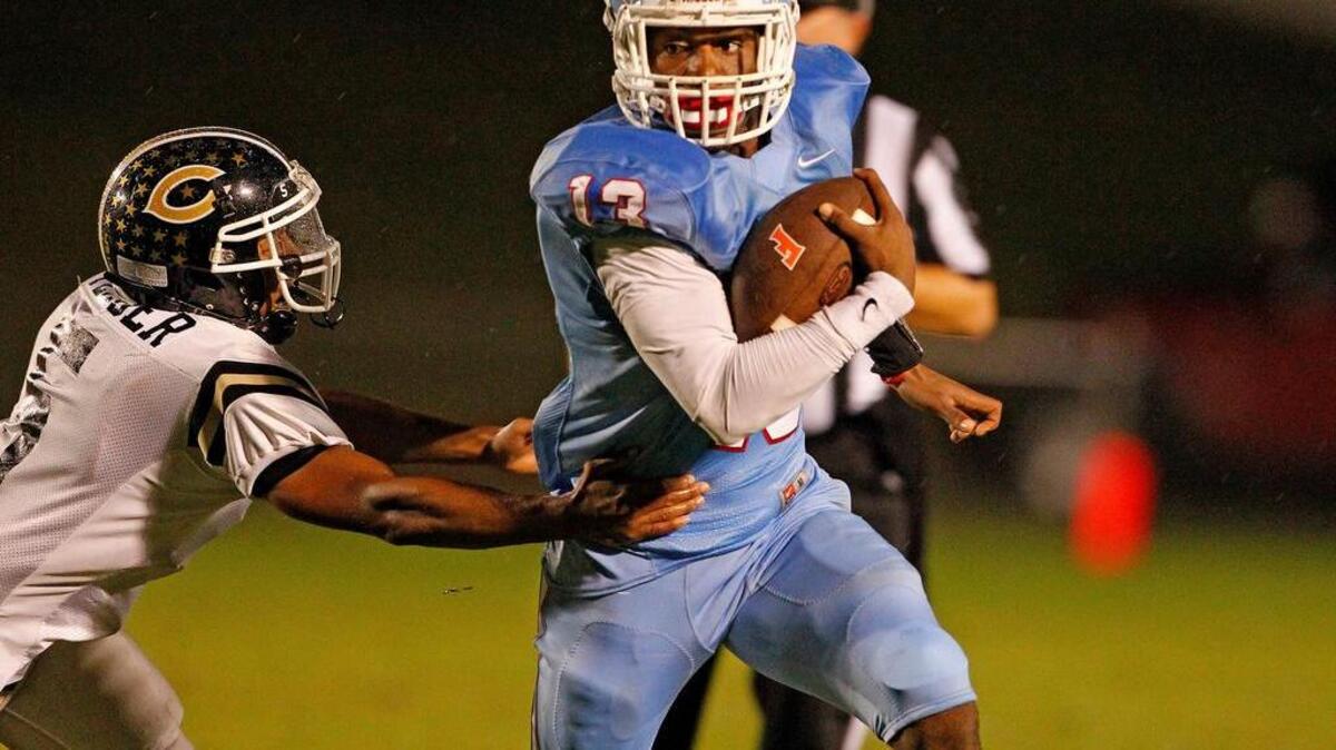 A.C. Flora quarterback Brendan Greene, right, and the Falcons face Chapman in the first round of the Class 3A playoffs Friday.