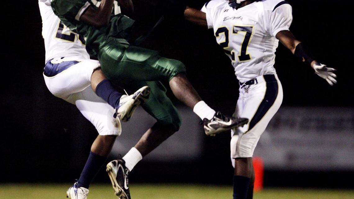 Blythewood's Justin Bethel, left, covers an Eau Claire receiver in 2007. Bethel’s jersey will be retired Friday by the Bengals.