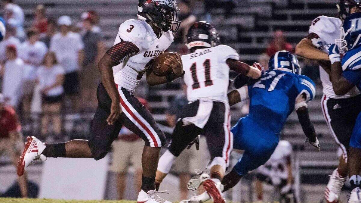 Gilbert’s Deandre Cook runs with football against Dreher last year. Gilbert moved their game against Pelion from Friday to Thursday this week because of threat of bad weather.