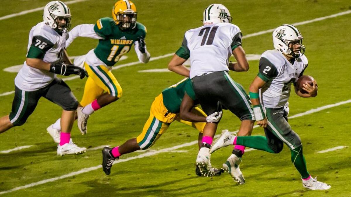Dutch Fork quarterback Reese Nichols runs for a long touchdown in the fourth quarter during the game between Dutch Fork and Spring Valley.