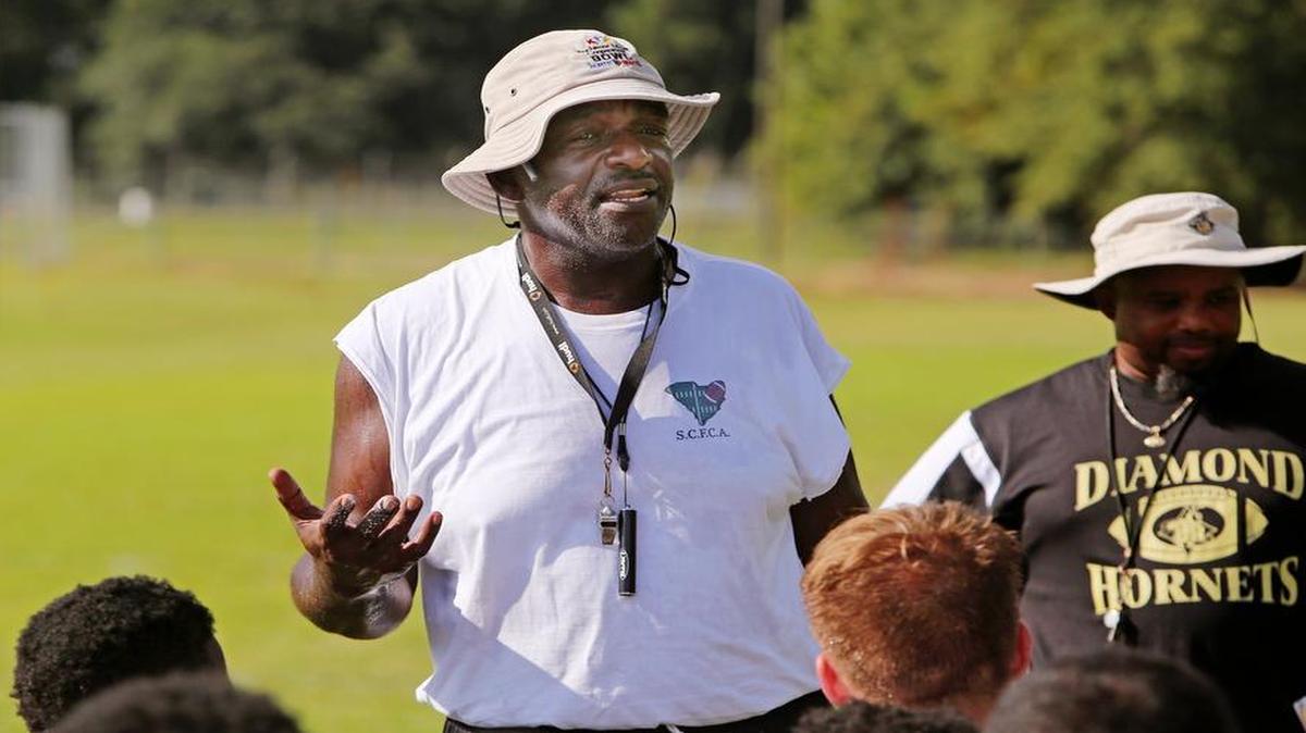 Lower Richland coach Darryl Page talks to his team. He is resigning.