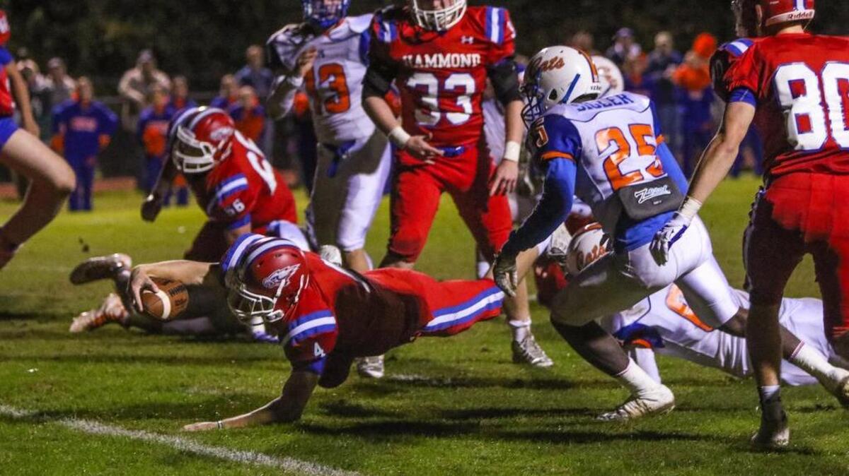 Hammond's Graham Smith (4) scores a touchdown against the Laurence Manning during the first round SCISA playoff game at Hammond Friday.