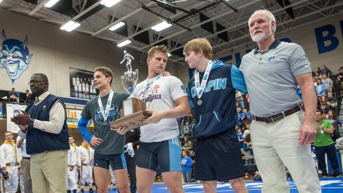 Chapin team captains accept the second place trophy after losing to Eastside in the 2017 Class 4A state wrestling championships. Chapin meets Eastside for the second straight year in the 4A championship.