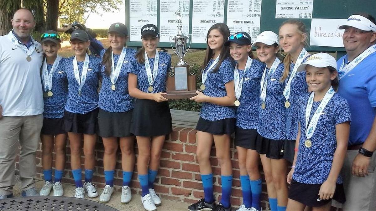 Lexington’s girls golf team poses with the trophy after winning the Class 5A tournament on Tuesday.