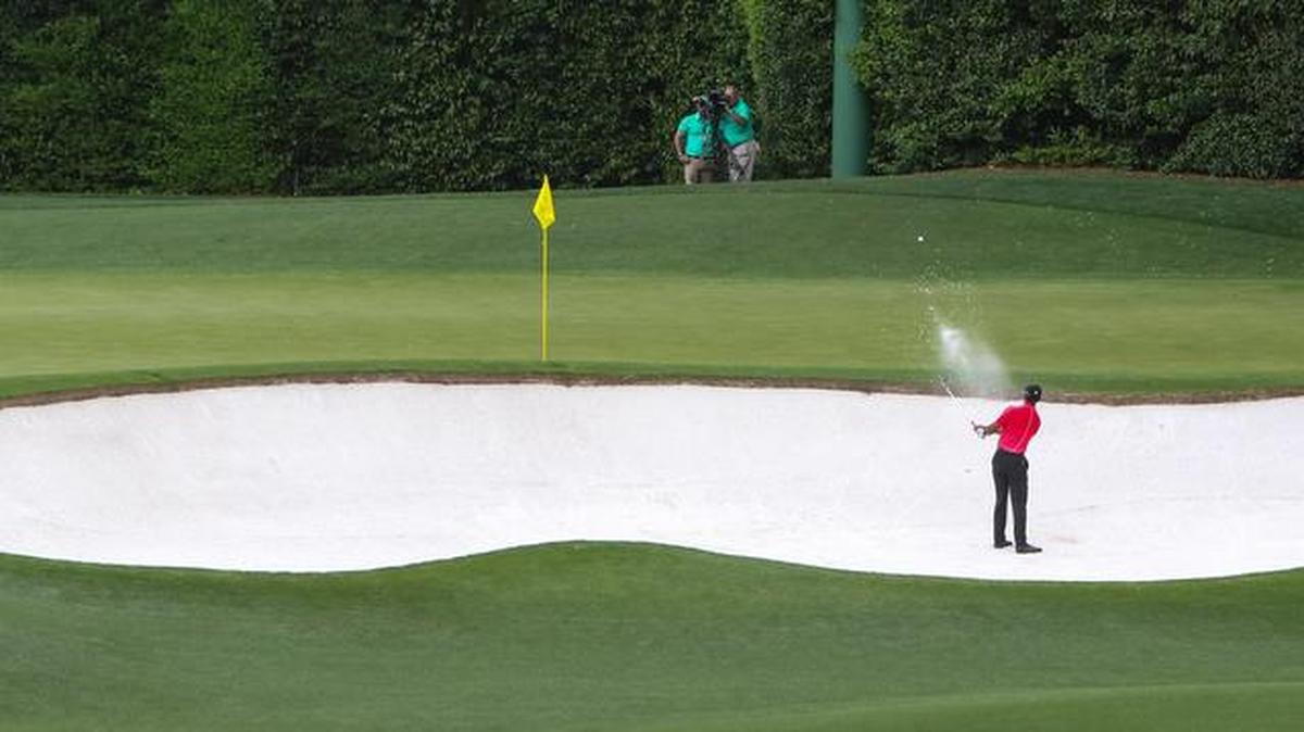 Tiger Woods hits from the bunker on the 4th hole during the final round of the 2015 tournament.