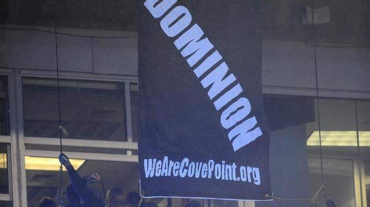 Protesters hang from cables attached to the upper level during the Carolina Panthers vs Indianapolis Colts game on Monday, November 2, 2015 at Bank of America Stadium in Charlotte, N.C.