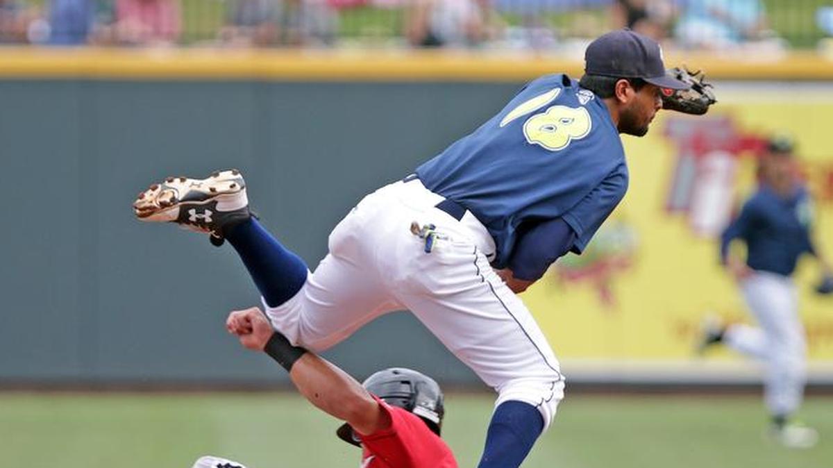 Columbia Fireflies infielder Luis Carpio turns a double play at Spirit Communications Park in June. The Columbia Fireflies and New York Mets announced Thursday that they are extending their Player Development Contract through the 2020 season.