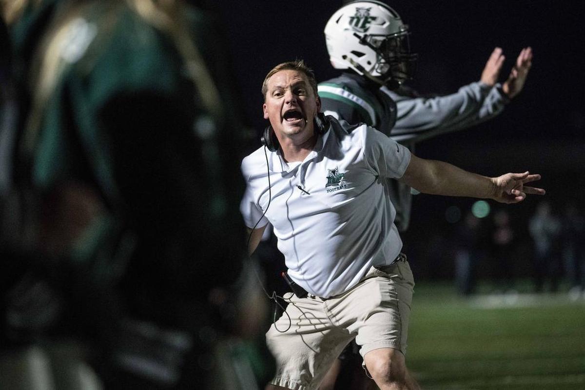 Dutch Fork defensive coordinator Nick Pelham communicates with players during a state semi final playoff game against Fort Dorchester on Nov. 24, 2017, at Dutch Fork High School . Dutch Fork defeated Fort Dorchester 24-14.