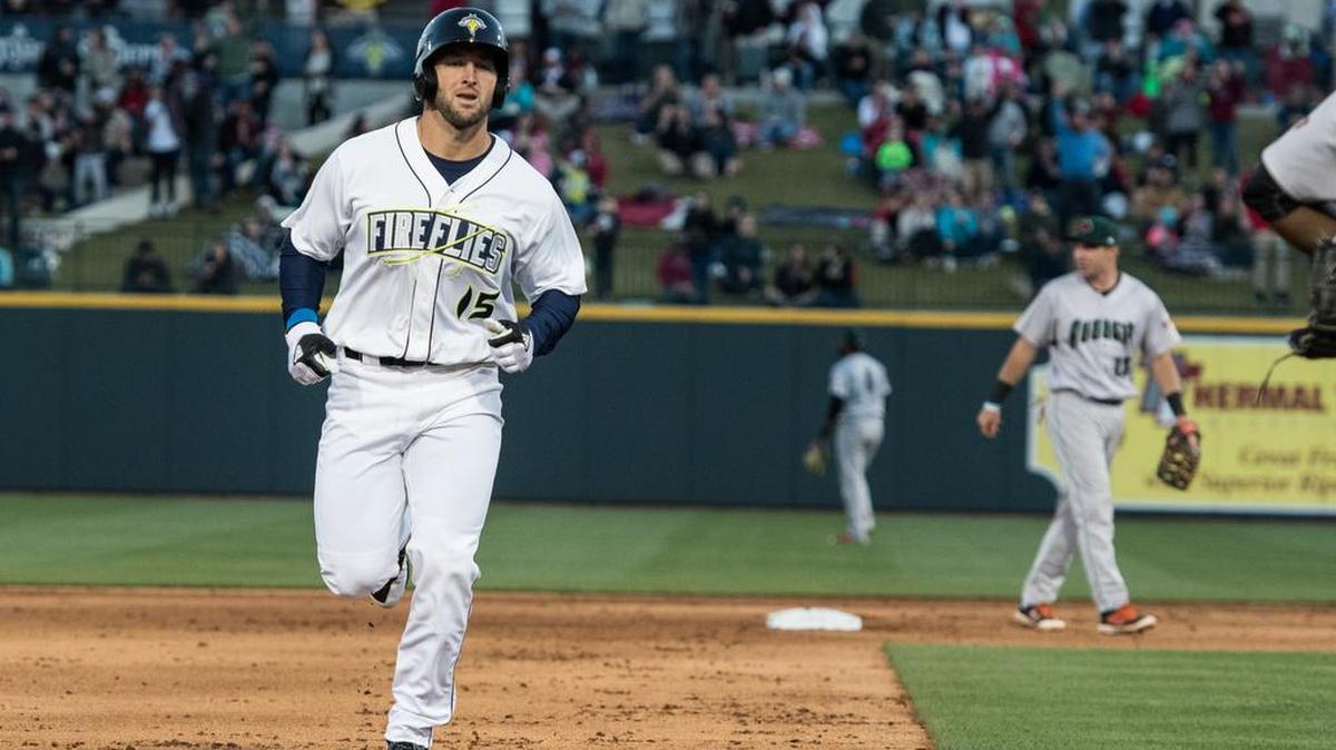 Tim Tebow runs the bases after hitting a home run.