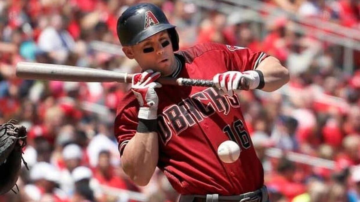 Arizona Diamondbacks' Chris Owings reacts after being hit while trying to bunt during the second inning Sunday against St. Louis. Owings, a Gilbert native, was placed on the 60-day disabled list Monday.