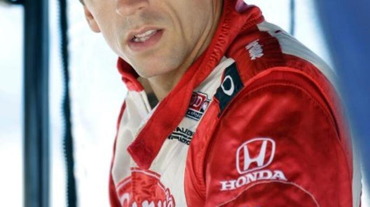 
File-This June 12, 2012, file photo shows Justin Wilson, of England, looking on during test laps for the Iowa Corn Indy 250 auto race at Iowa Speedway in Newton, Iowa. Wilson has died from a head injury suffered when a piece of debris struck him at Pocono Raceway. He was 37. IndyCar made the announcement on Monday, Aug. 24, 2015, at Indianapolis Motor Speedway. (AP Photo/Charlie Neibergall, File) 
