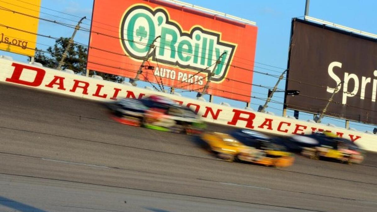 
In this April 12, 2014, file photo, drivers race during a NASCAR Sprint Cup series auto race at Darlington Raceway in Darlington, S.C. Darlington Raceway is quiet this Mother's Day weekend after nearly a decade as NASCAR's focal point for honoring mom. But raceway president Chip Wile was pleased with the track's recently run Southern 500 last month and is excited about what's ahead for the sport's oldest superspeedway. (AP Photo/Mike McCarn, File)

