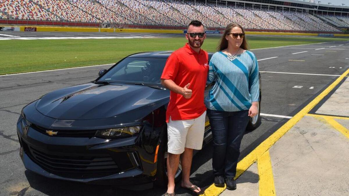 Cam Oswald, a Columbia farmer, poses NASCAR driver Austin Dillon after winning $250,000 in a contest sponsored by Coke.