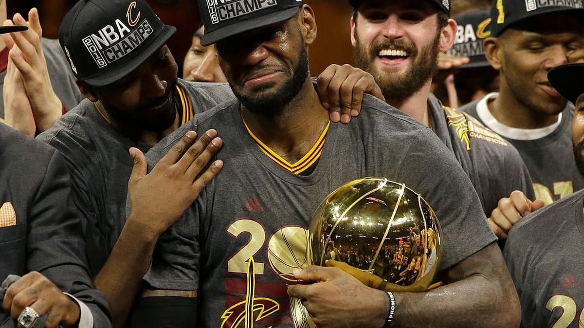Cleveland Cavaliers forward LeBron James, center, celebrates with teammates after Game 7 of basketball's NBA Finals against the Golden State Warriors in Oakland, Calif., Sunday, June 19, 2016. The Cavaliers won 93-89.