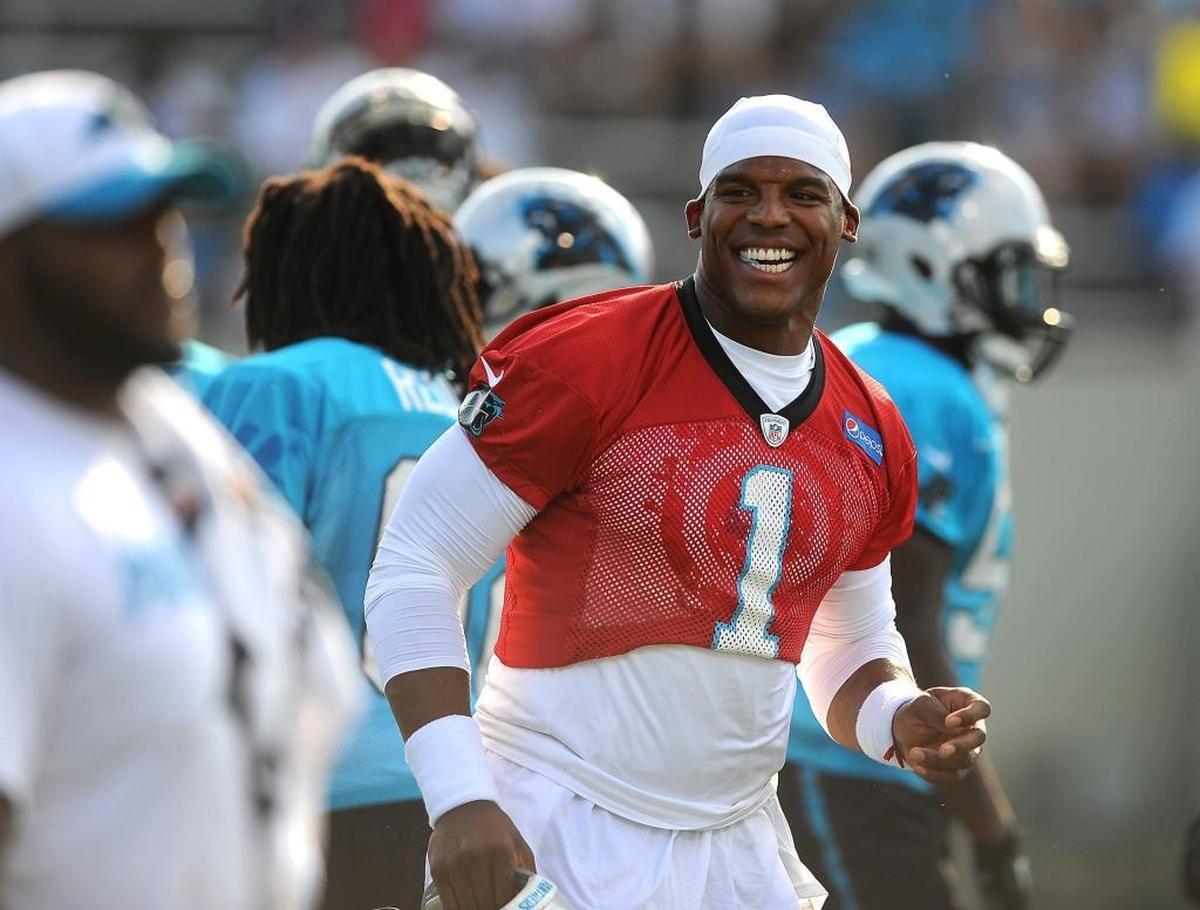 Carolina Panthers quarterback Cam Newton smiles at a 2015 training camp practice.