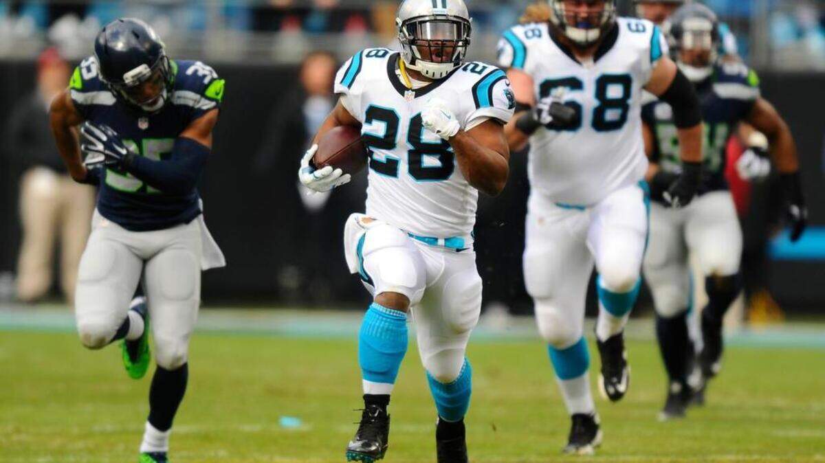 Carolina Panthers running back Jonathan Stewart (28) breaks off a 59-yard run on the Panthers’ first play from scrimmage against the Seattle Seahawks on Sunday.