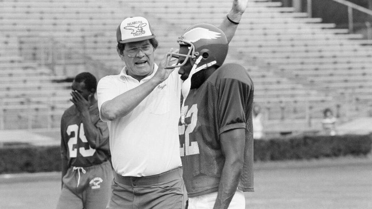 FILE - In this July 17, 1984, file photo, Philadelphia Eagles head coach Marion Campbell gestures as he describes a play to a Eagles' Brenard Wilson during the first day of two-a-day drills at the team's training camp at West Chester University in West Chester, Pa. Former Eagles coach Marion Campbell, who played on Philadelphia's last NFL championship team in 1960, has died. He was 87. The team announced late Sunday night, July 17, 2016, that Campbell passed away last Wednesday in Plano, Texas. (AP Photo/Art Wilkinson, File)