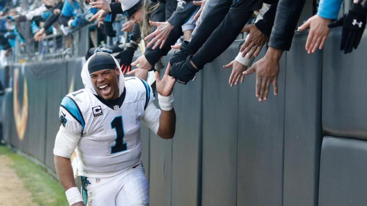 Carolina Panthers quarterback Cam Newton (1) celebrates with fans after the second half of an NFL divisional playoff football game against the Seattle Seahawks, Sunday, Jan. 17, 2016, in Charlotte, N.C. The Panthers won 31-24.