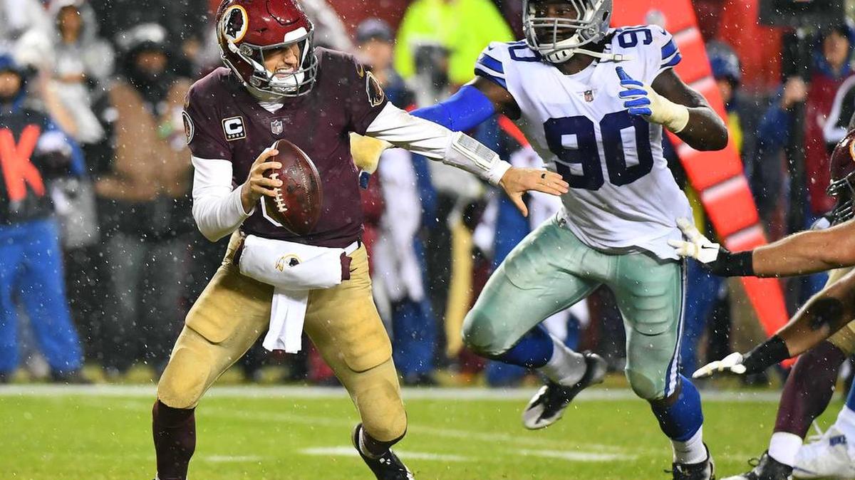 Dallas Cowboys defensive end Demarcus Lawrence (90) sacks Washington Redskins quarterback Kirk Cousins (8) during the second half at FedEx Field.