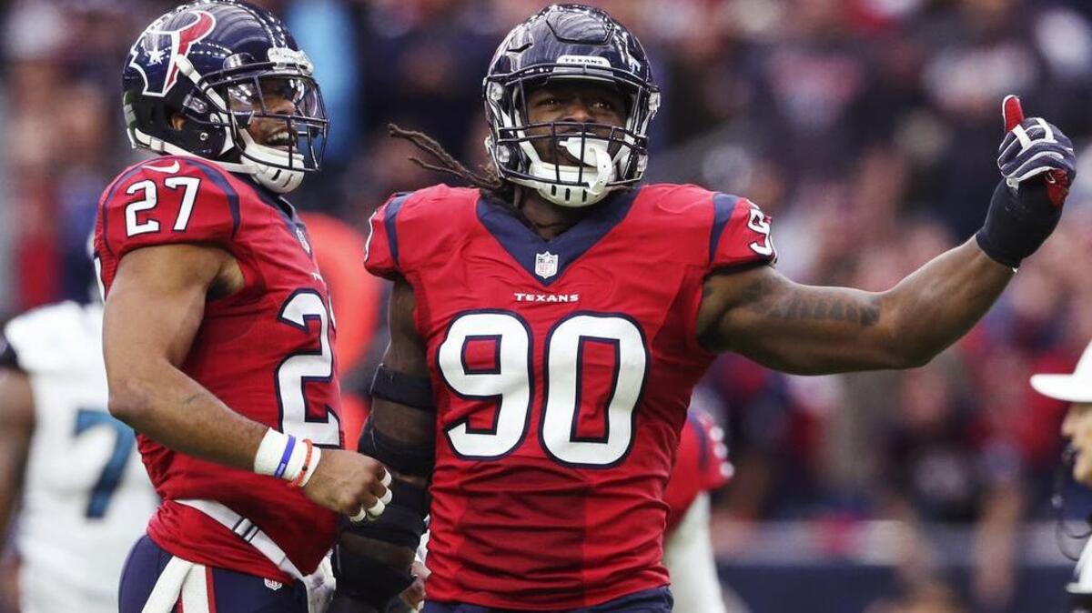 Houston Texans defensive end Jadeveon Clowney (90) celebrates with strong safety Quintin Demps (27) during the second half against the Jacksonville Jaguars at NRG Stadium.