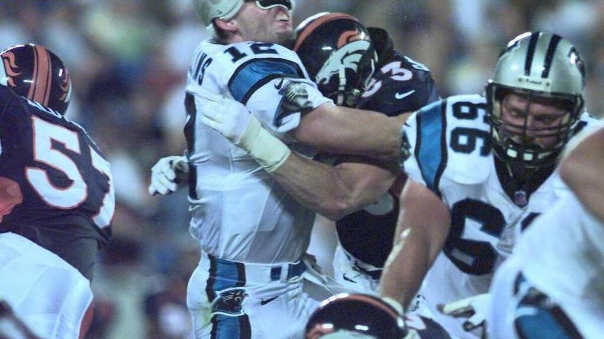 Denver's Bill Romanowski delivers a stunning hit on Panthers quarterback Kerry Collins in a 1997 game. Collins suffered a broken jaw.